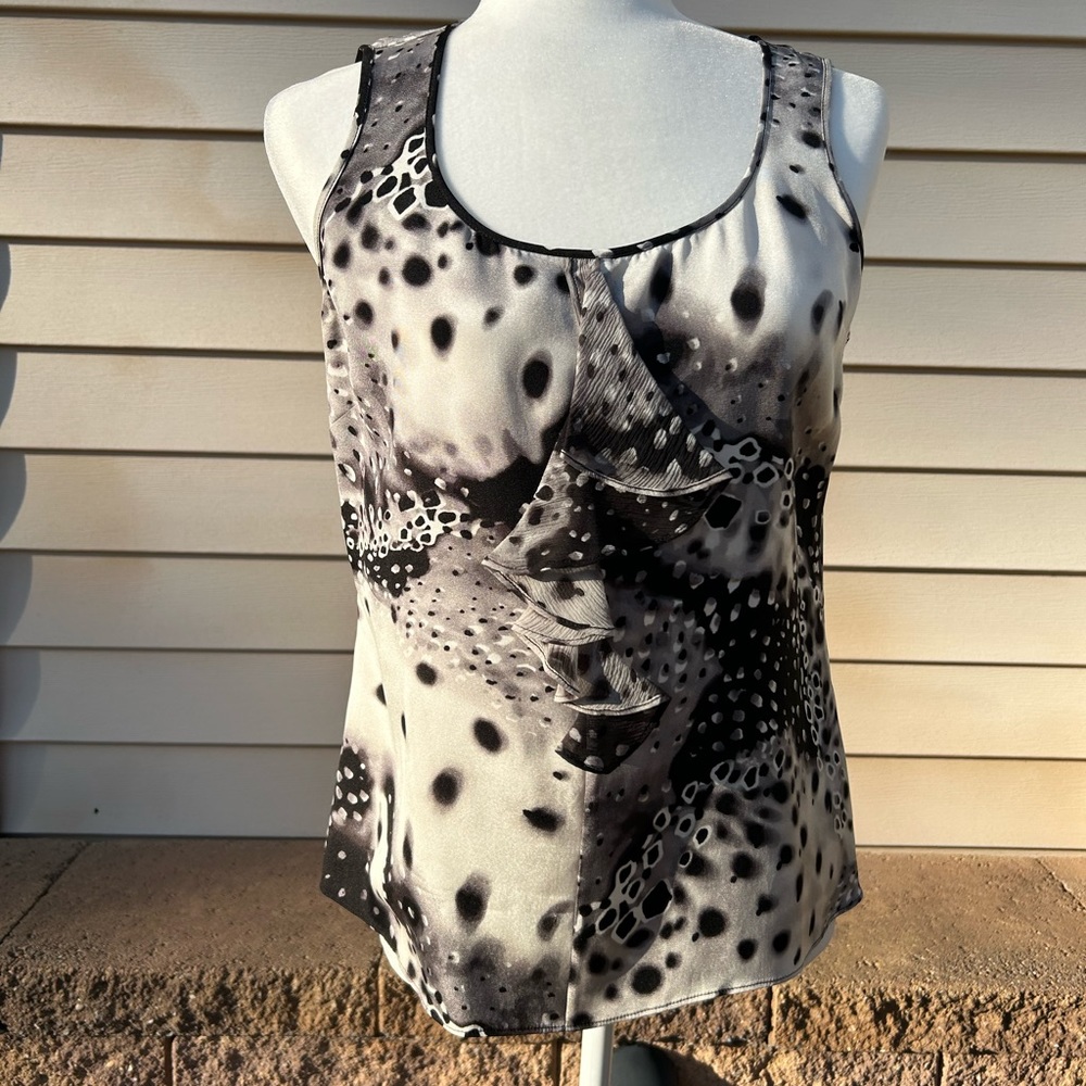 St. John sleeveless blouse,front ruffle, side zipper.  Size small
